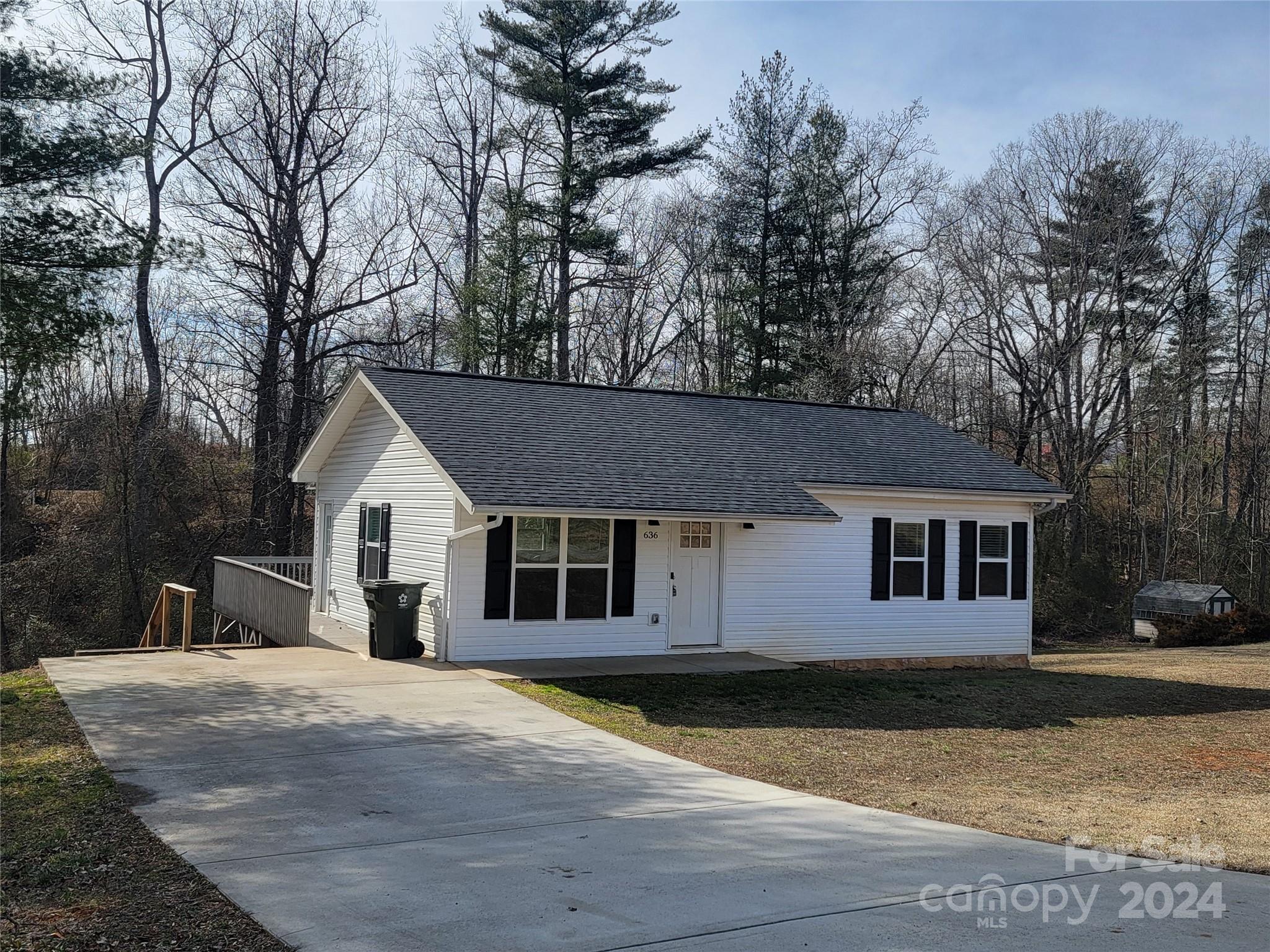 636 Hawthorne Street Hudson, NC 28638 - Photo 3 of 21 a view of a house with a yard covered with snow in front of house
