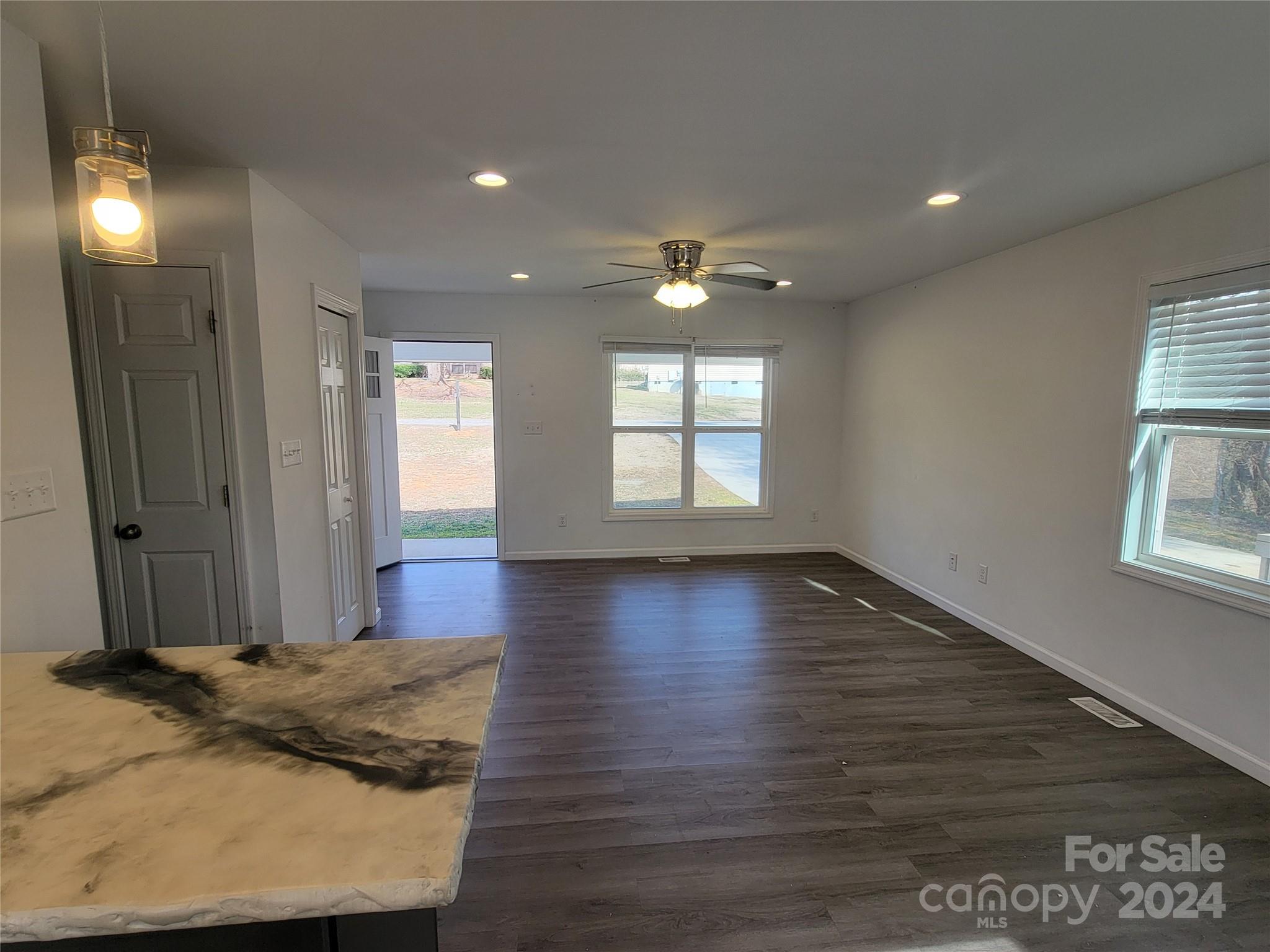 636 Hawthorne Street Hudson, NC 28638 - Photo 8 of 21 a view of a livingroom with wooden floor and window