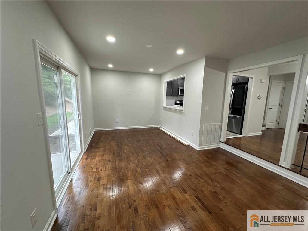 3303 Hana Road Edison, NJ 08817 - Photo 20 of 47 wooden floor in an empty room with a window
