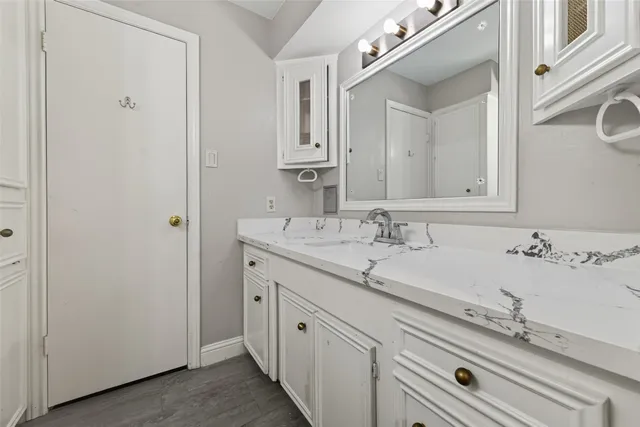 a bathroom with a sink and a mirror