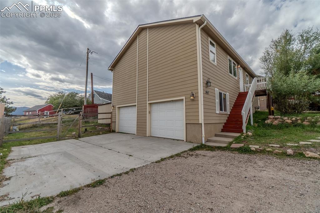 863 Circle Road Palmer Lake, CO 80133 - Photo 13 of 48 a view of a house with backyard