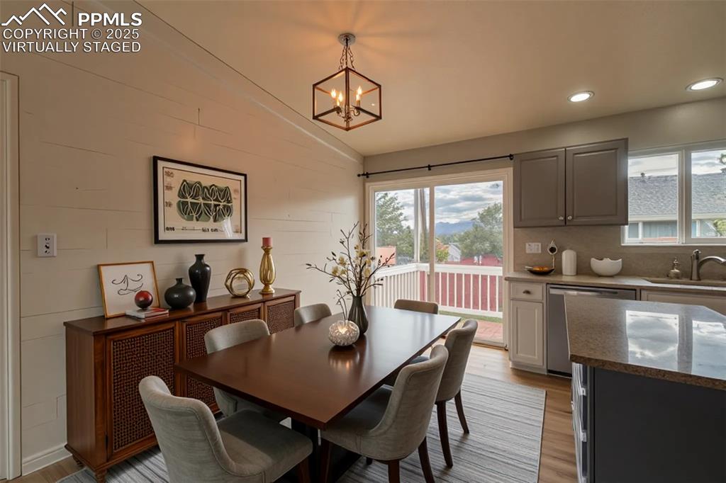 863 Circle Road Palmer Lake, CO 80133 - Photo 5 of 48 a view of a dining room with furniture window and outside view