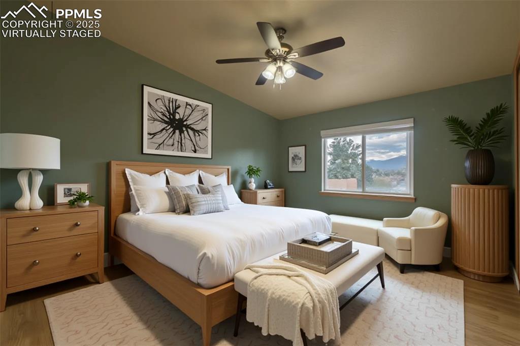 863 Circle Road Palmer Lake, CO 80133 - Photo 6 of 48 a bedroom with bed and a window