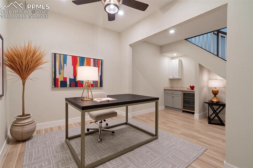 863 Circle Road Palmer Lake, CO 80133 - Photo 10 of 48 a living room with furniture and a wooden floor