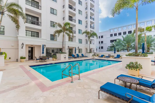 a view of an swimming pool with a lounge chairs