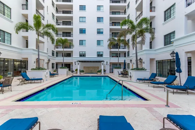 a view of a swimming pool with chairs