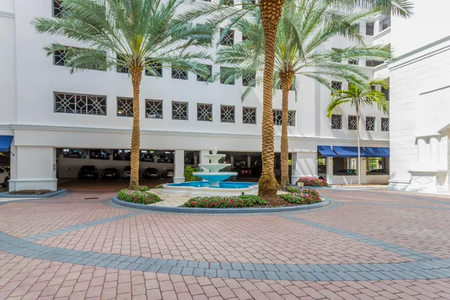a front view of a building with garden