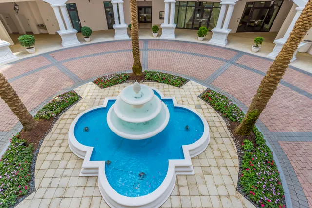 a bathroom with a toilet and a shower curtain