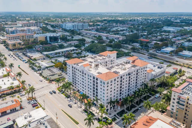 an aerial view of residential building and lake
