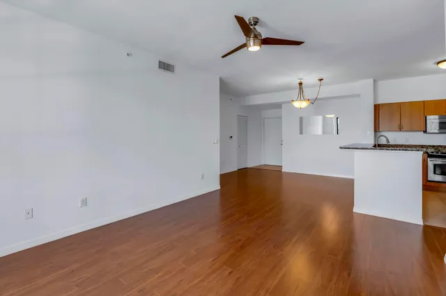 a view of kitchen and wooden floor
