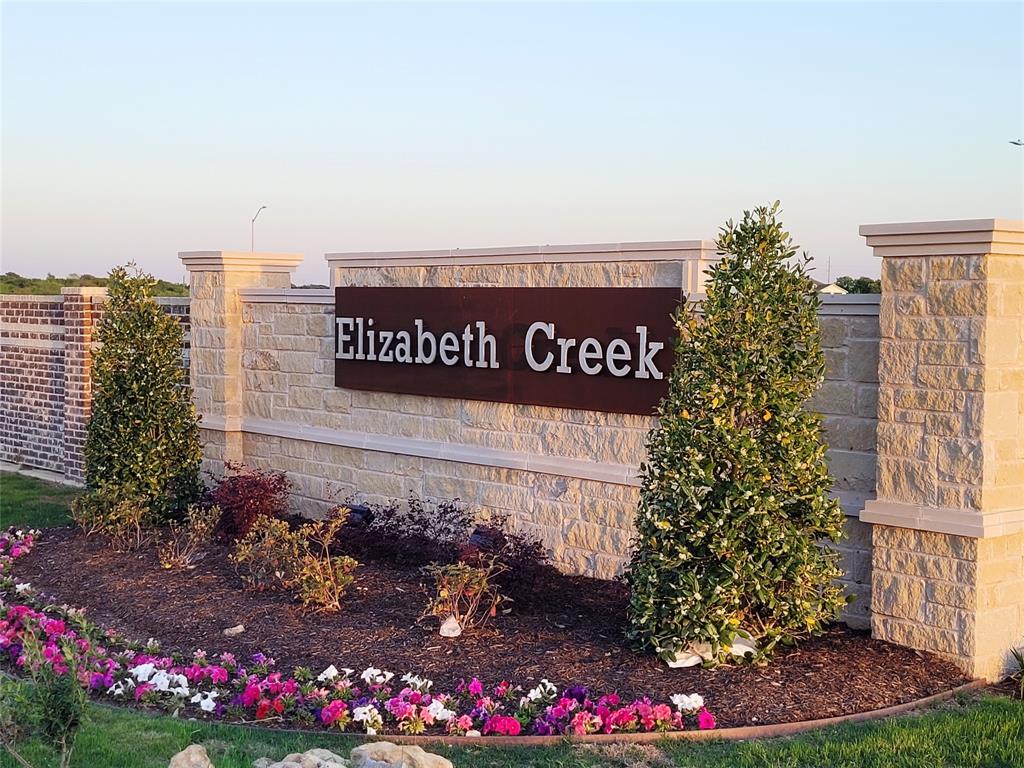 16029 Pemberly Lane Haslet, TX 76052 - Photo 18 of 19 a sign that is sitting in front of flowers