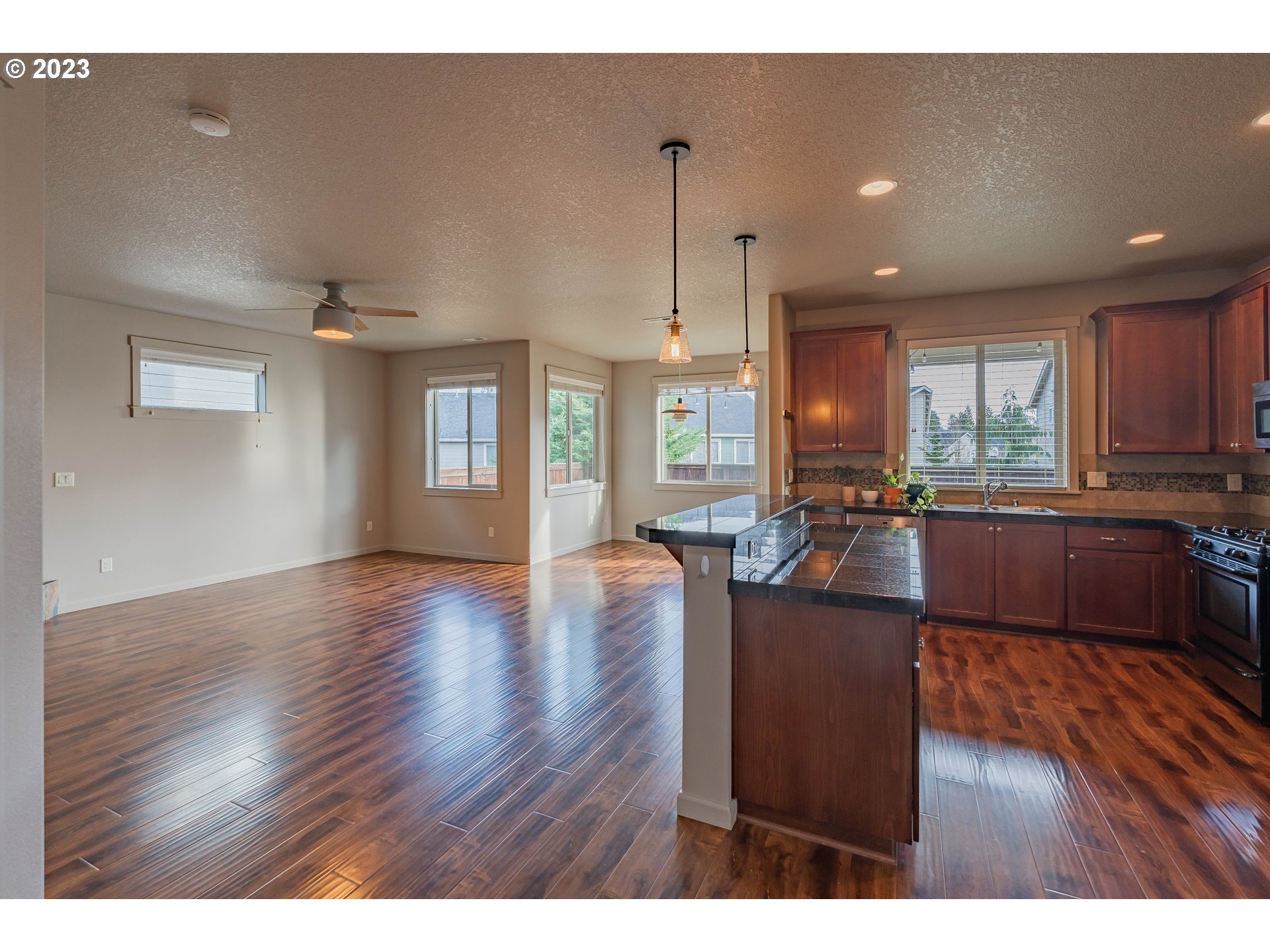 522 North 40th Avenue Ridgefield, WA 98642 - Photo 3 of 32 a open kitchen with cabinets table and chairs
