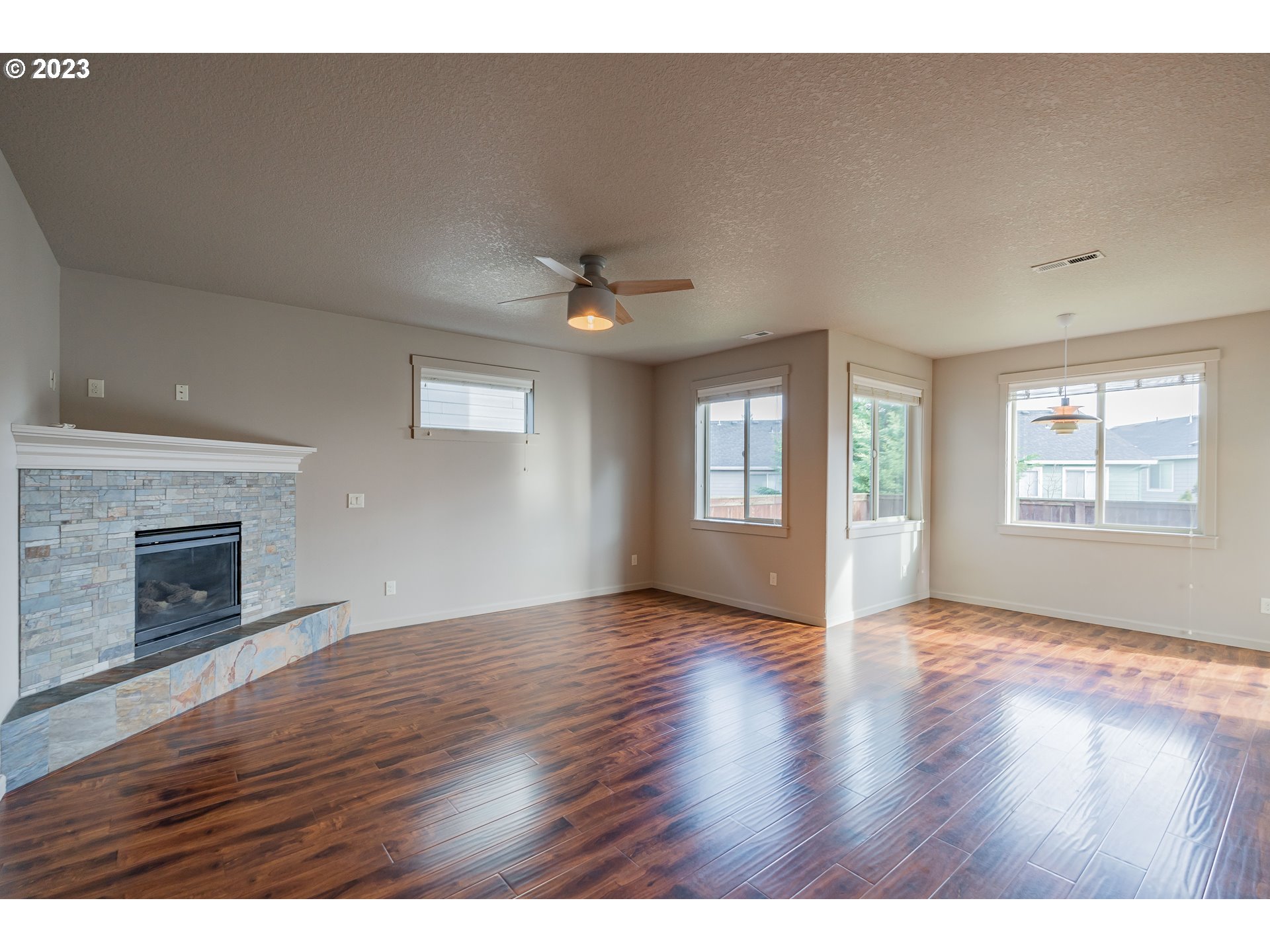 522 North 40th Avenue Ridgefield, WA 98642 - Photo 8 of 32 a view of an empty room with window and wooden floor