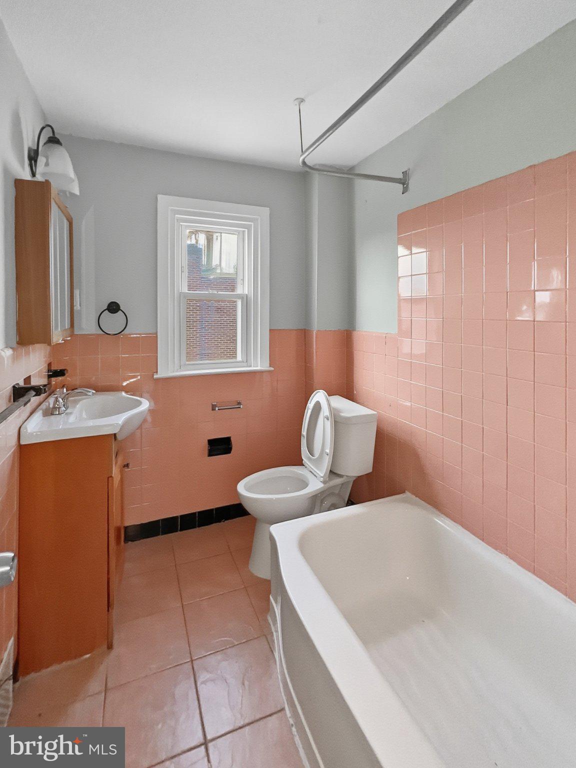 920 Butler Street Chester, PA 19013 - Photo 9 of 10 Charming vintage bathroom with pastel tiles.