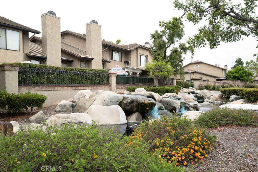 1917 Cobblefield Way Glendora, CA 91740 - Photo 41 of 45 a front view of a house with a yard and fountain