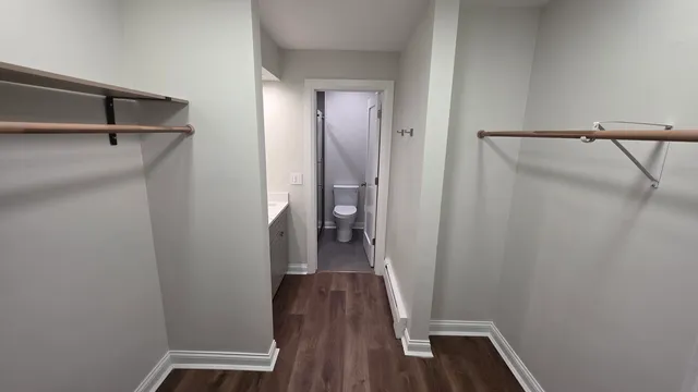 a view of a room with wooden floor