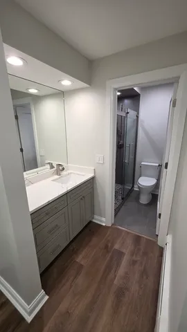 a bathroom with a double vanity sink and mirror