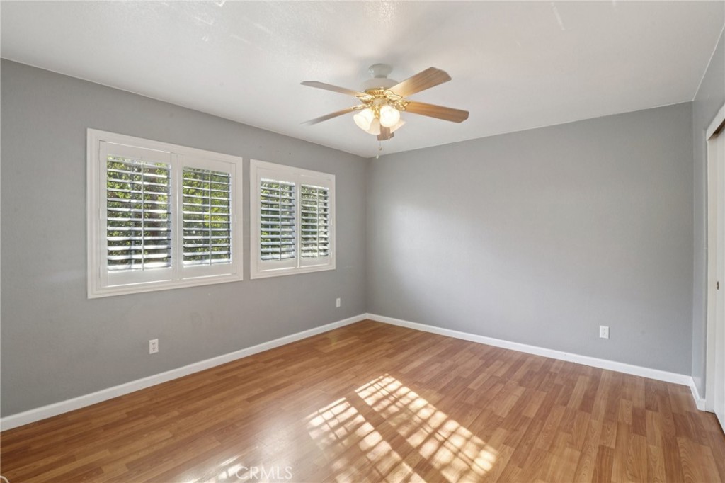 4310 Forest Ranch Way Oceanside, CA 92057 - Photo 27 of 50 a view of an empty room with wooden floor and a window