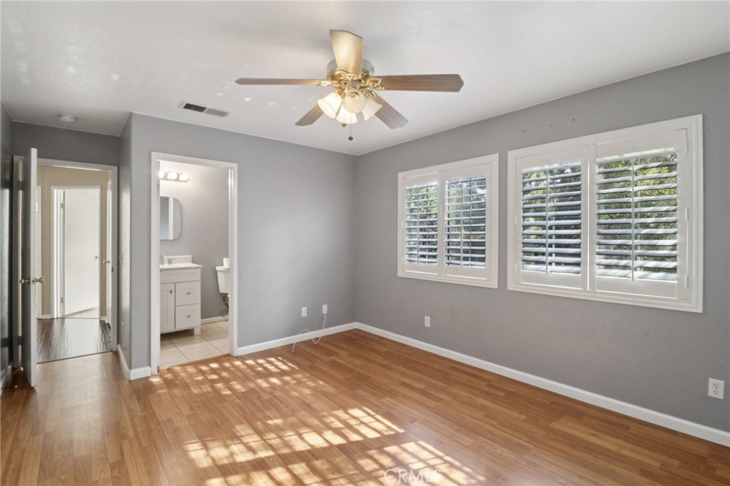 4310 Forest Ranch Way Oceanside, CA 92057 - Photo 28 of 50 a view of an empty room with a window and wooden floor
