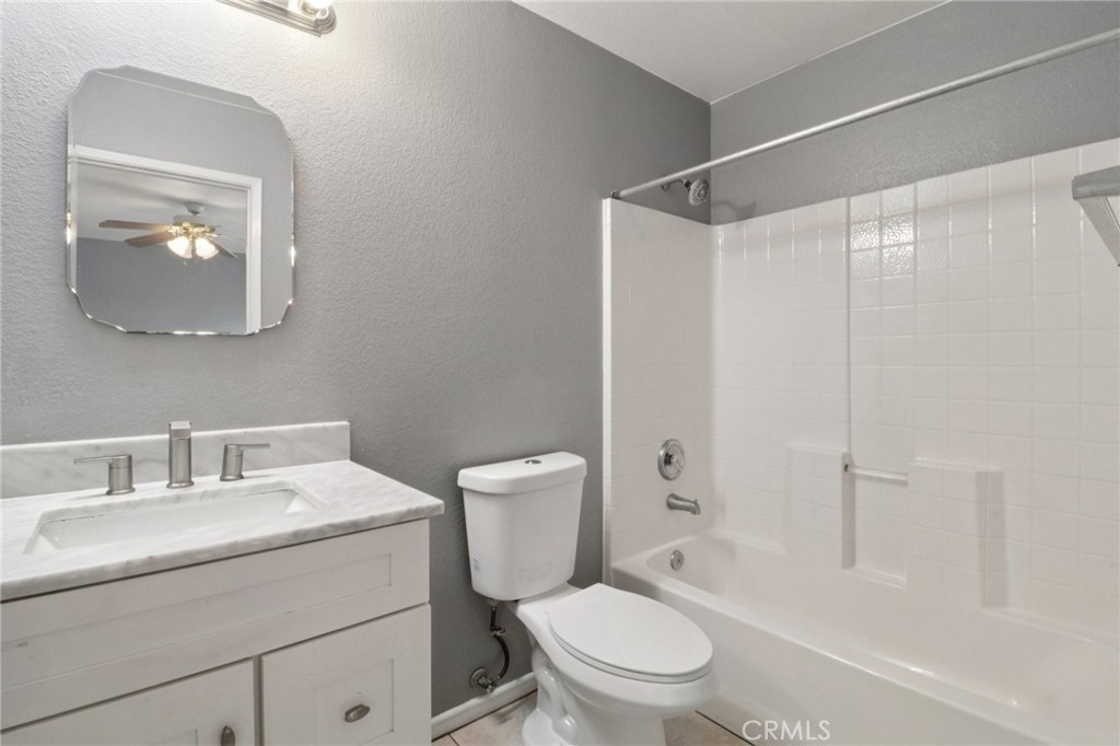 4310 Forest Ranch Way Oceanside, CA 92057 - Photo 29 of 50 a bathroom with a toilet sink vanity and shower