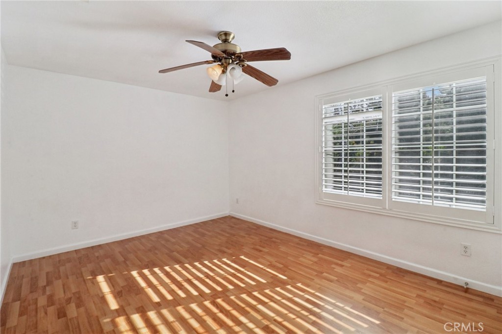 4310 Forest Ranch Way Oceanside, CA 92057 - Photo 30 of 50 a view of a big room with wooden floor and windows