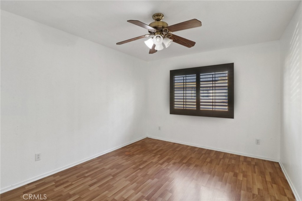 4310 Forest Ranch Way Oceanside, CA 92057 - Photo 32 of 50 a view of an empty room with wooden floor and a window