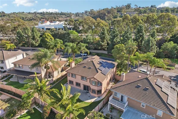 an aerial view of a residential apartment building with a yard
