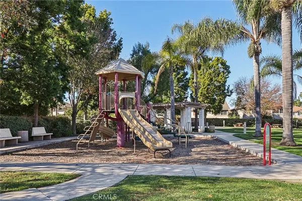 a view of a park with swings and slides