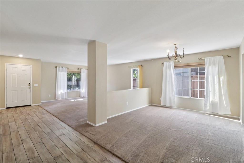 4310 Forest Ranch Way Oceanside, CA 92057 - Photo 7 of 50 a view of livingroom with hardwood floor and window