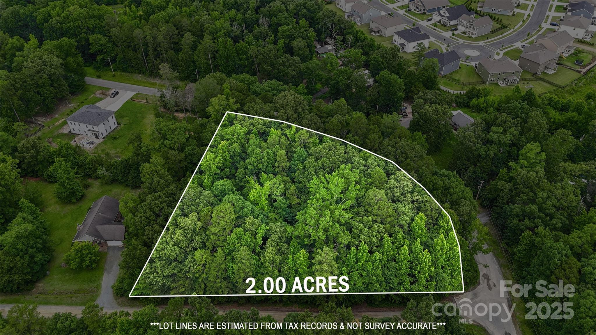 an aerial view of a house with a garden