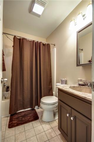7378 Walker Road Fairview, TN 37062 - Photo 14 of 20 Secondary bath with tile, updated cabinet and lighting.