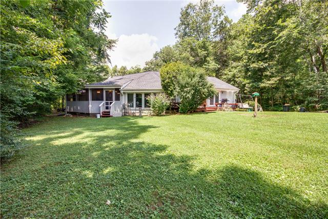 7378 Walker Road Fairview, TN 37062 - Photo 18 of 20 Back and side view of the home. Level lot with nature all around.