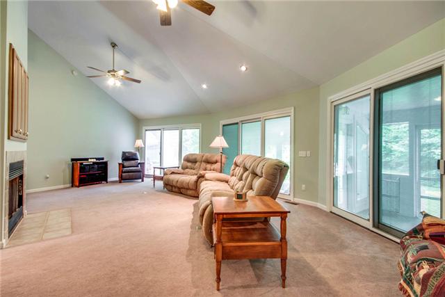 7378 Walker Road Fairview, TN 37062 - Photo 3 of 20 Living room with sliding doors that let the light in and invite you to the outdoor porches. Dual ceiling fans.