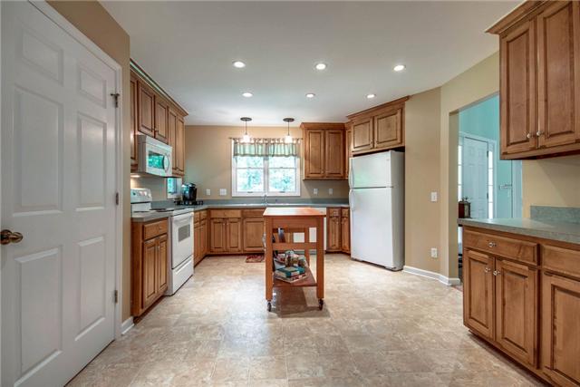 7378 Walker Road Fairview, TN 37062 - Photo 7 of 20 Kitchen with space for an island. Windows, recessed lighting and pendant lights over sink keep this kitchen bright.