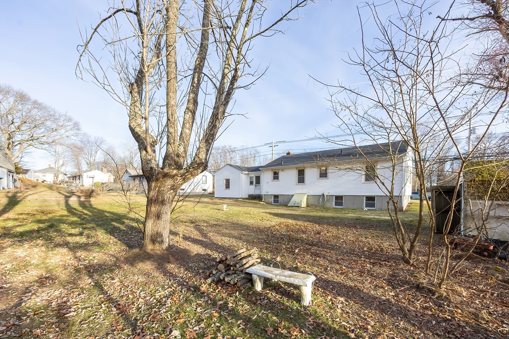 1123 County Street Attleboro, MA 02703 - Photo 19 of 20 a view of a house with a yard covered in snow