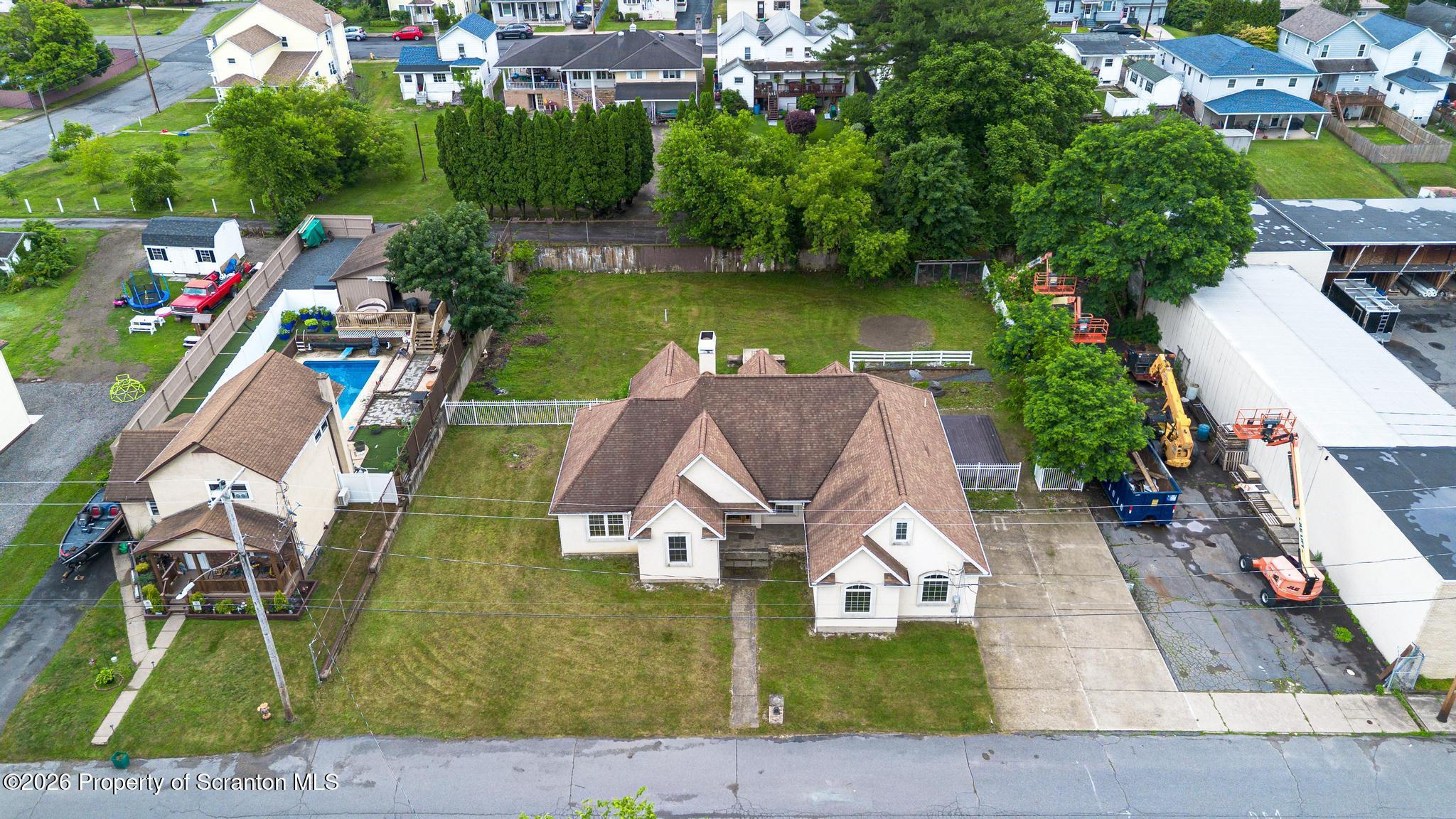 116 Forge Street Old Forge, PA 18518 - Photo 45 of 49 an aerial view of a house with swimming pool a yard and a patio