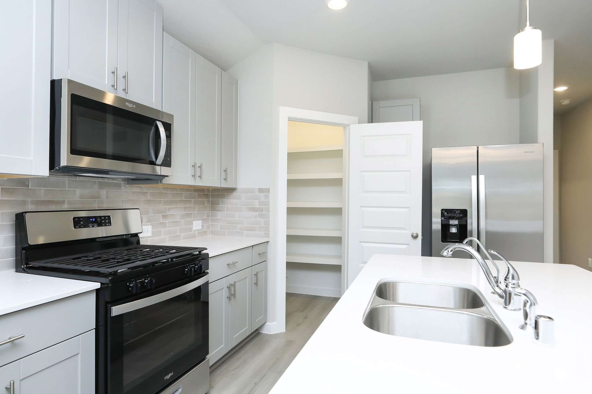 14110 Greystone Ter Street Magnolia, TX 77354 - Photo 5 of 34 The Kitchen Also Offers A Spacious Walk-In Pantry For Added Storage. Please Note That The Frigerator Stays With The Home As Well!