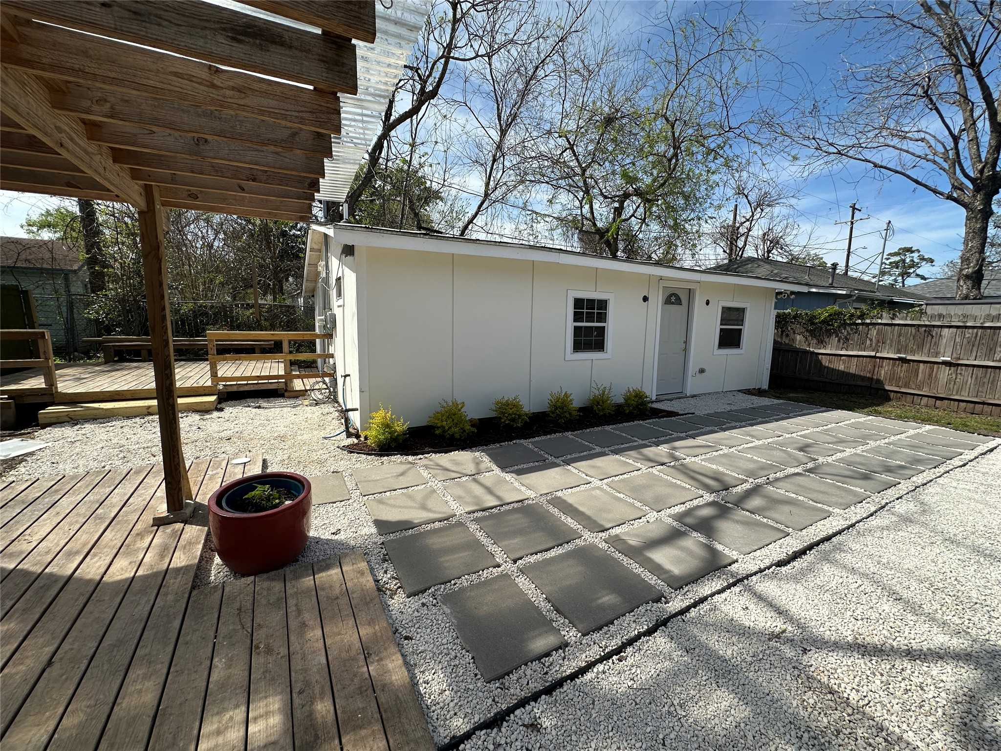 4109 Edison Street Houston, TX 77009 - Photo 1 of 8 a view of a backyard with wooden floor and roof