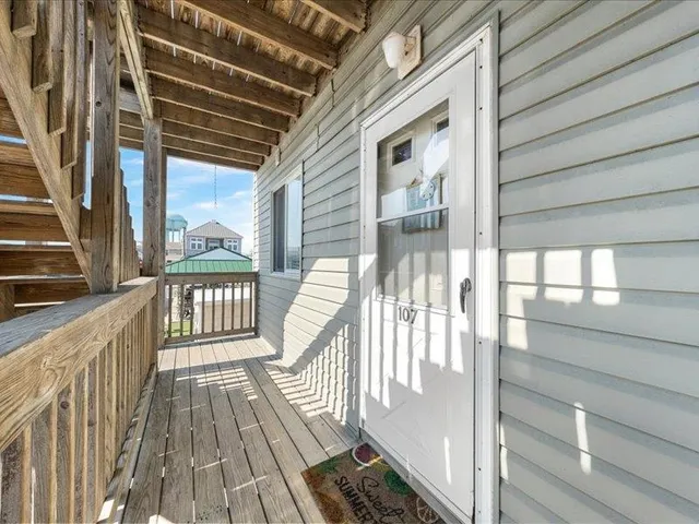a kitchen with a refrigerator sink and cabinets