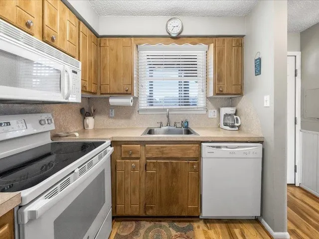 a bathroom with a toilet a sink and a mirror