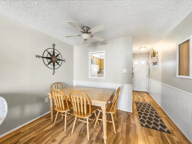 a bedroom with two beds and a table