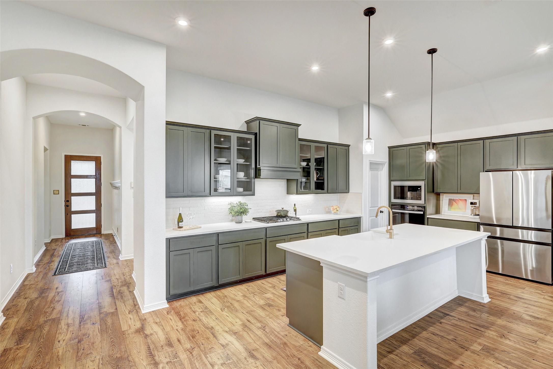 1117 Spring Gulch Lane Georgetown, TX 78628 - Photo 5 of 39 Culinary excellence awaits in this kitchen featuring high ceilings, generous counter space, and integrated appliances.