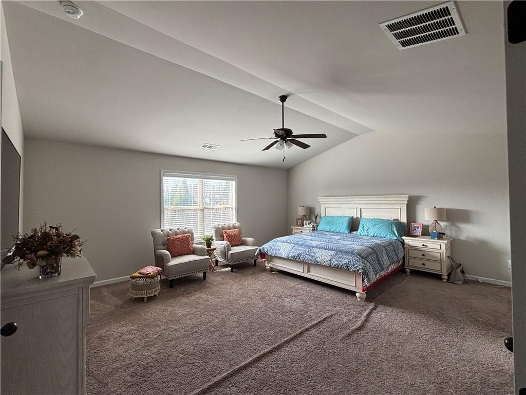 3459 In Bloom Way Auburn, GA 30011 - Photo 24 of 35 a bedroom with bed couch and window