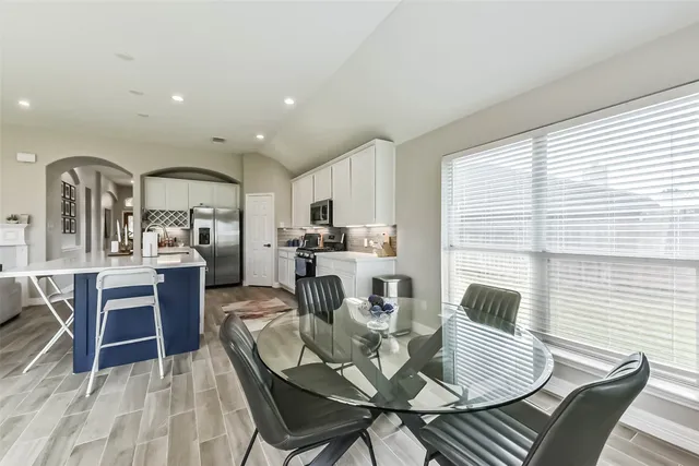 a view of a dining room with furniture