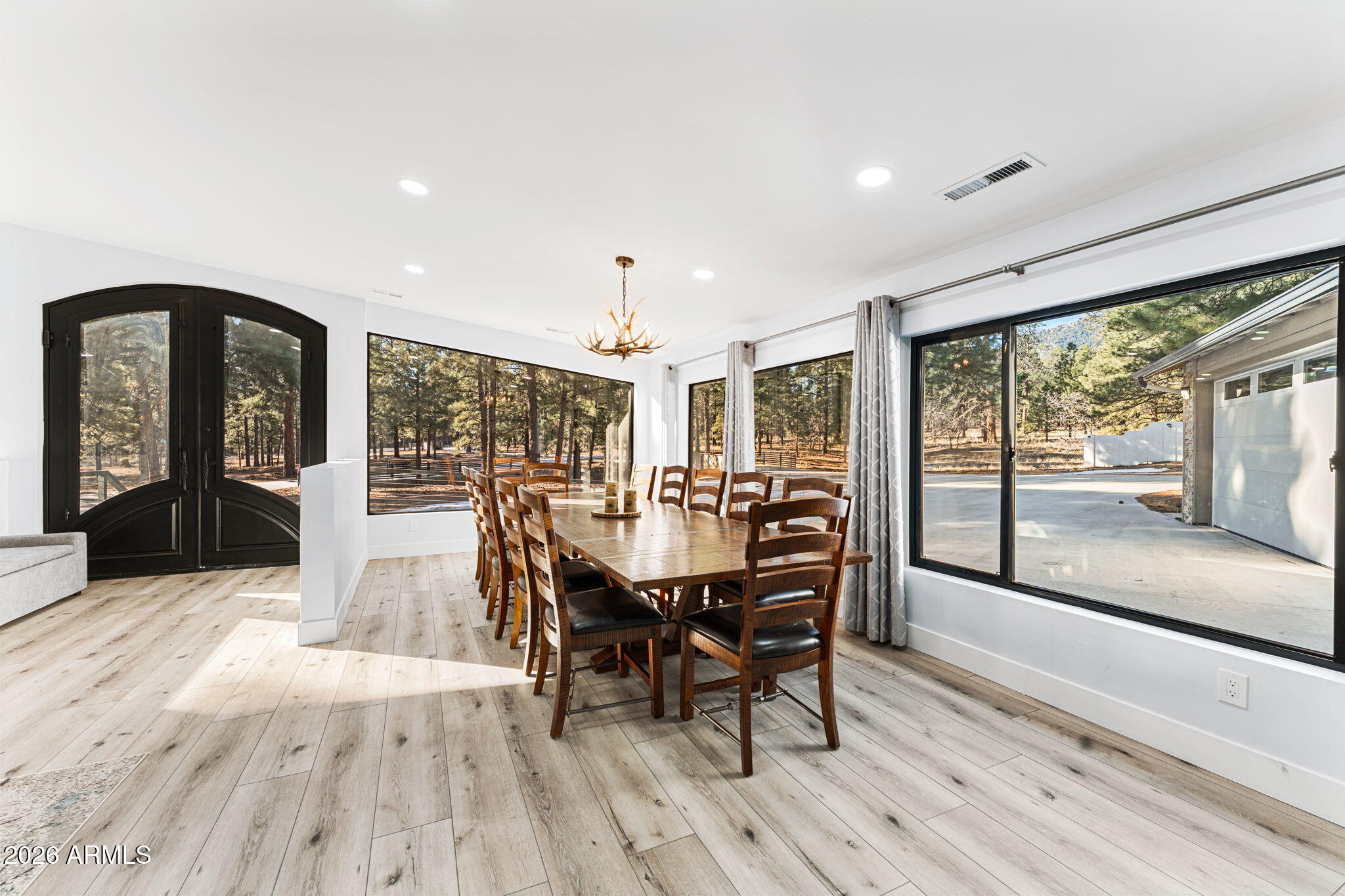 5055 Townsend-Winona Road Flagstaff, AZ 86004 - Photo 9 of 34 a view of a dining room with furniture window and wooden floor