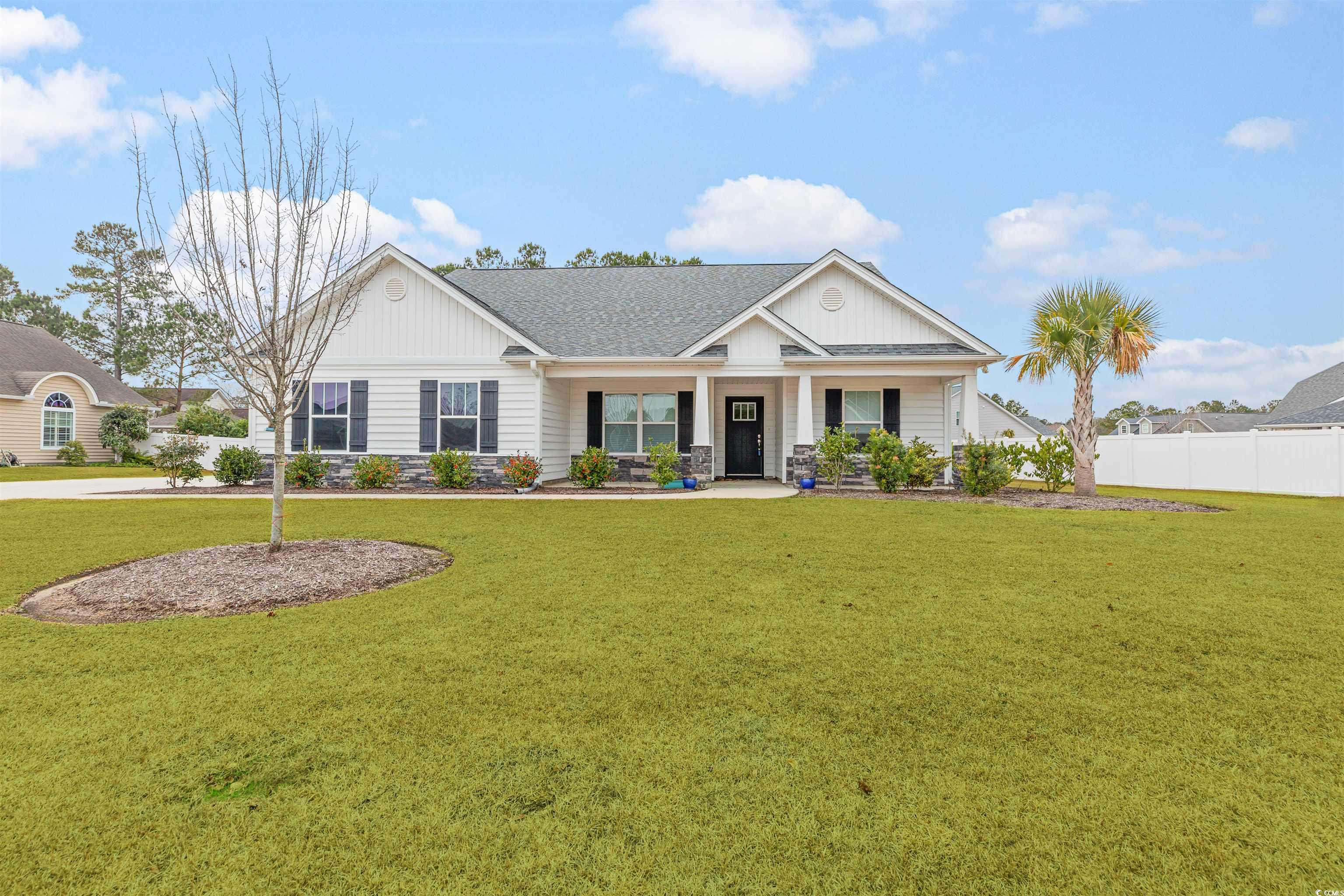 317 Marsh Tacky Loop Myrtle Beach, SC 29588 - Photo 1 of 29 View of front of home featuring a front yard and c
