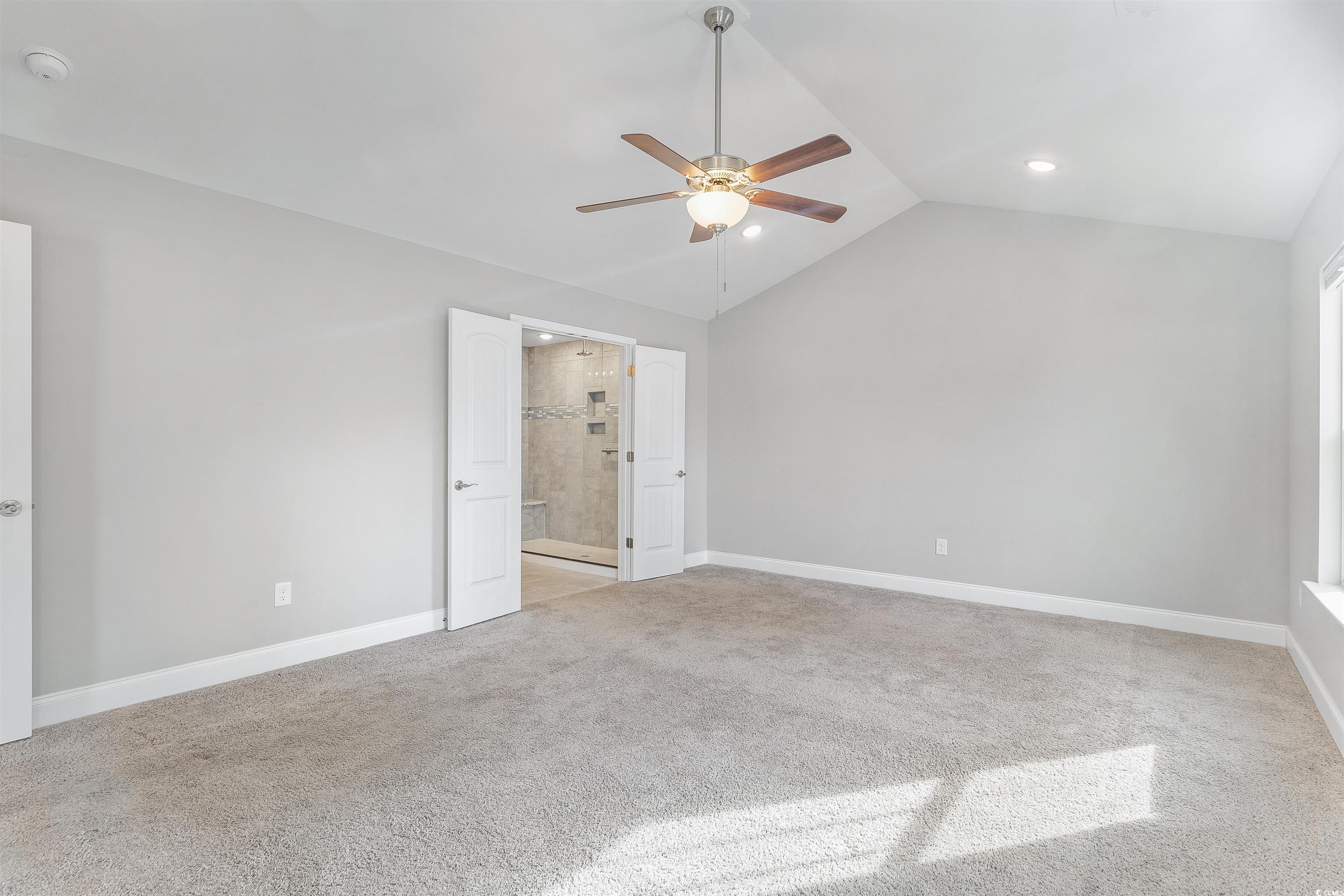 317 Marsh Tacky Loop Myrtle Beach, SC 29588 - Photo 13 of 29 Unfurnished bedroom with ceiling fan, ensuite bath
