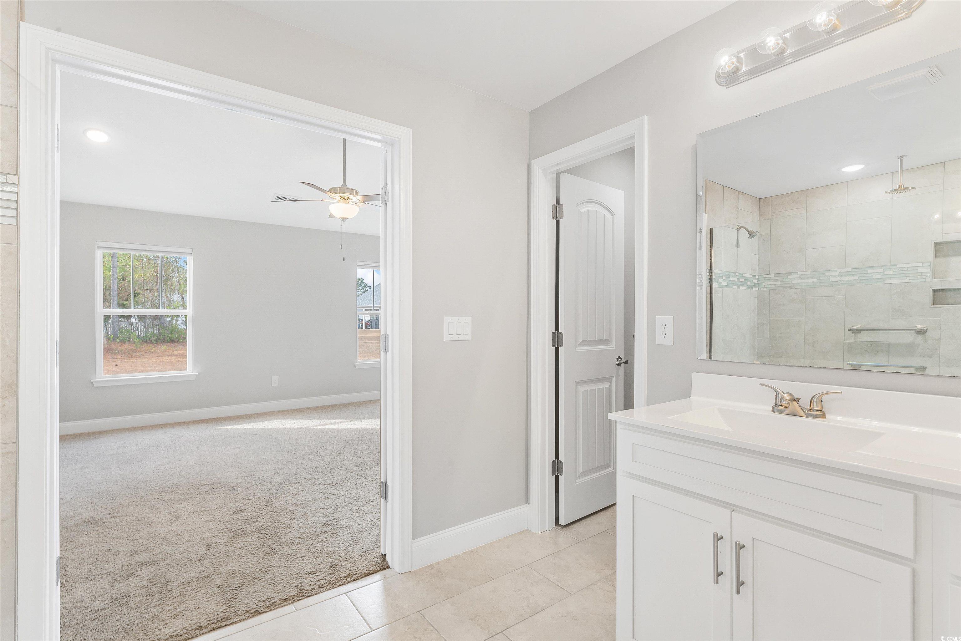 317 Marsh Tacky Loop Myrtle Beach, SC 29588 - Photo 14 of 29 Bathroom featuring tile patterned flooring, ceilin