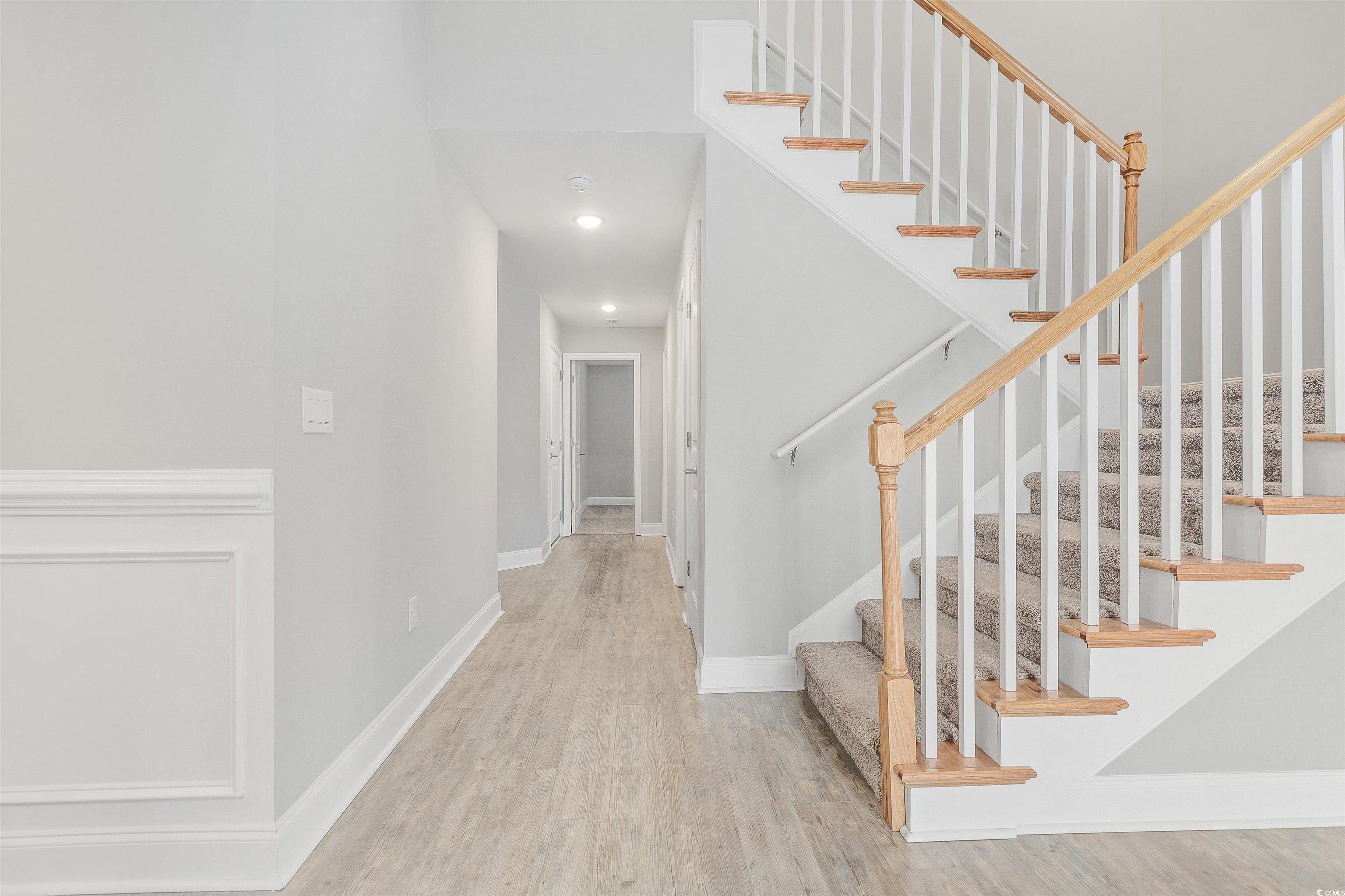 317 Marsh Tacky Loop Myrtle Beach, SC 29588 - Photo 20 of 29 Staircase featuring hardwood / wood-style floors