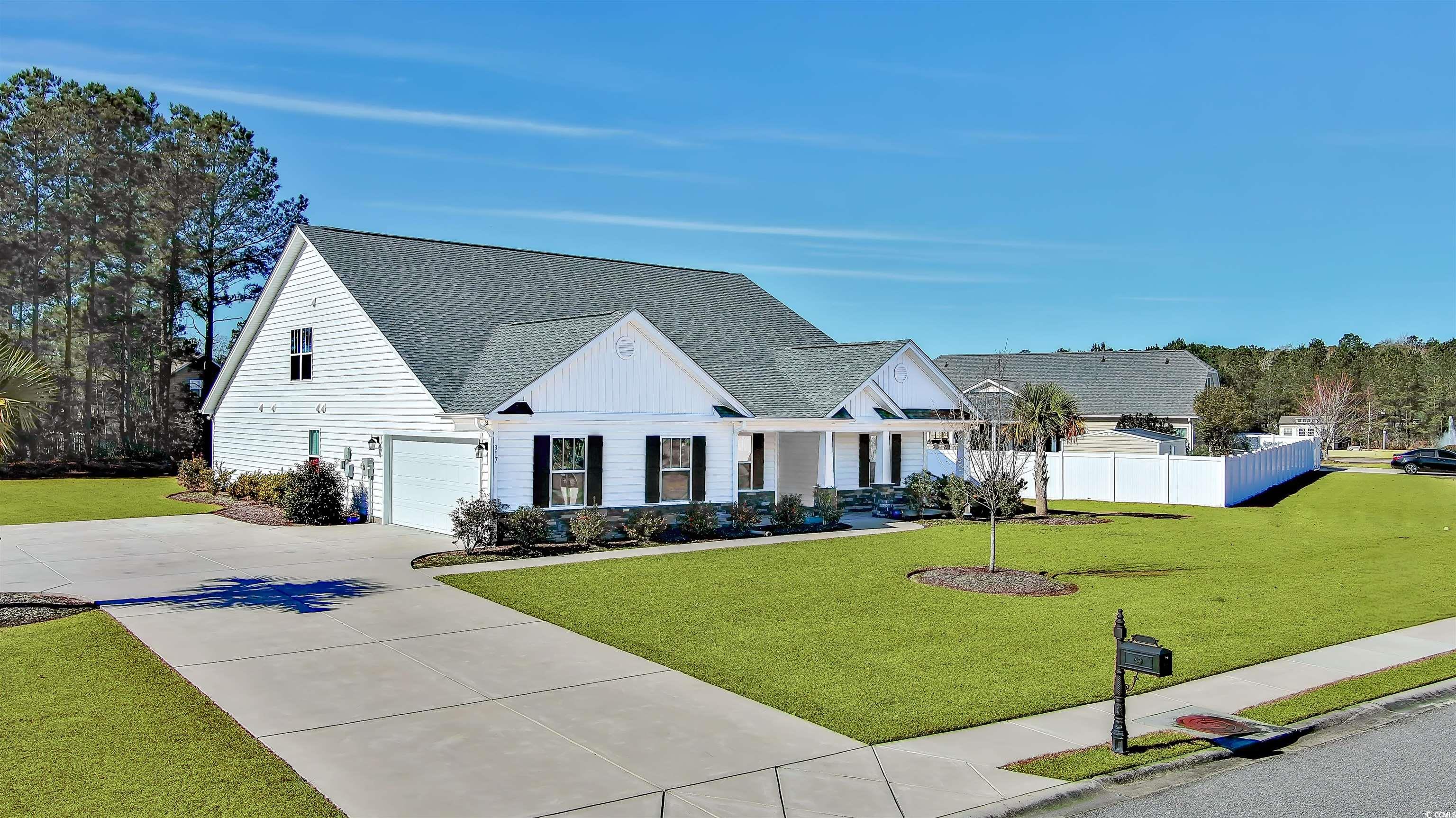 317 Marsh Tacky Loop Myrtle Beach, SC 29588 - Photo 2 of 29 Modern inspired farmhouse with a front lawn and a